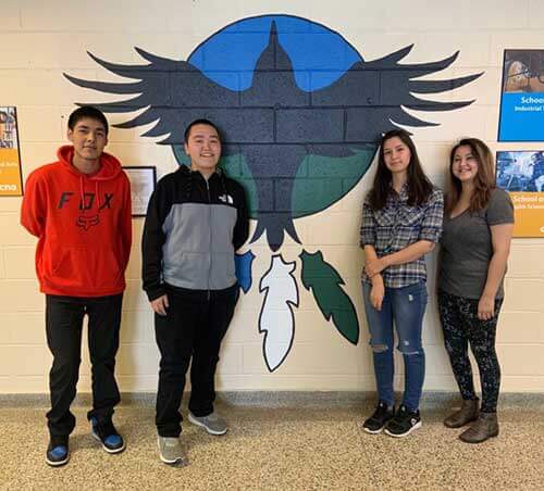 Students standing in the indigenous resource centre at Happy Valley-Goose Bay