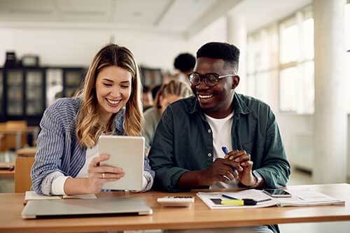 students studying with a tutor
